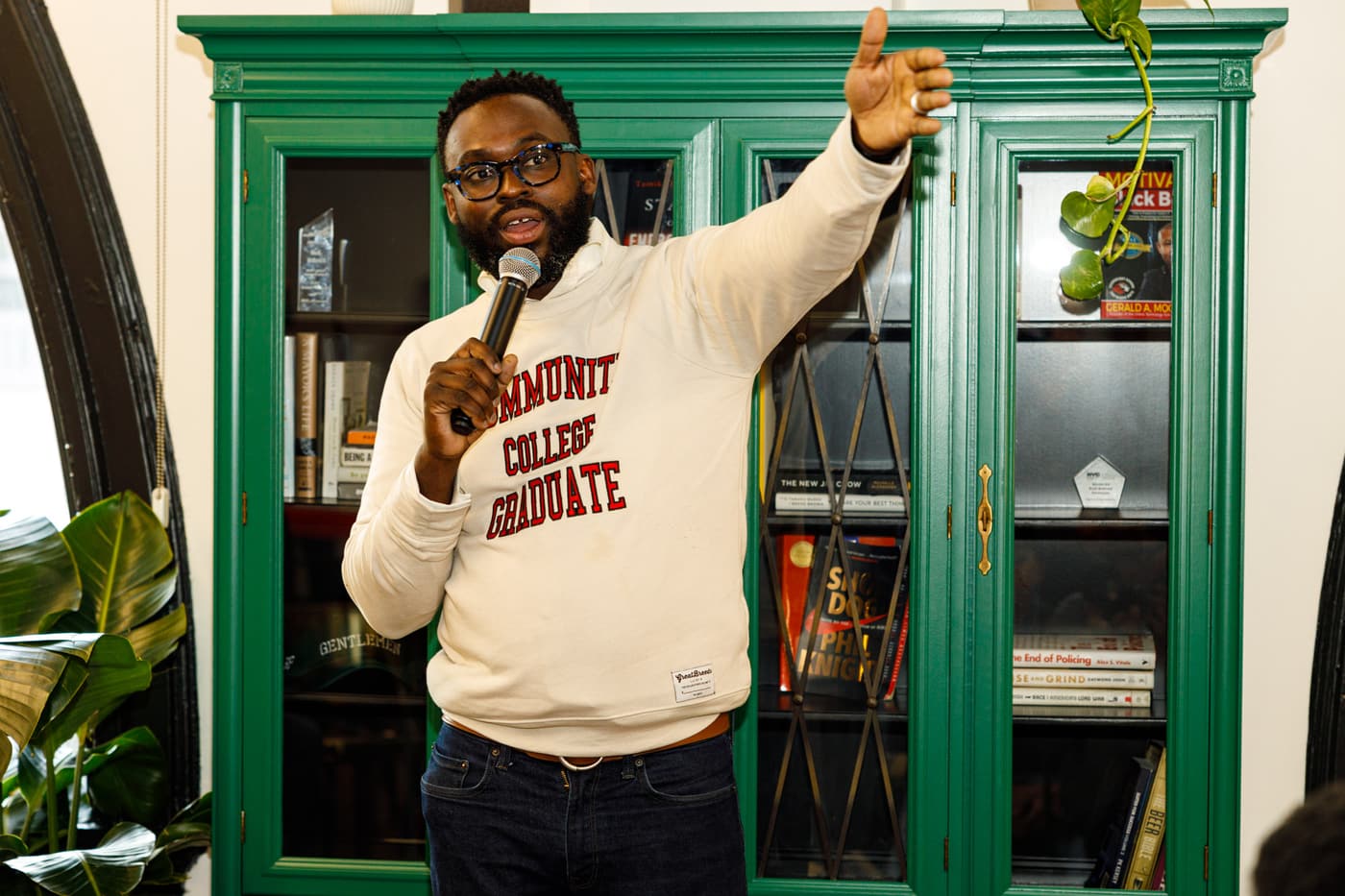 Speaking at the Gentlemen's Factory grand opening, wearing his community college story.